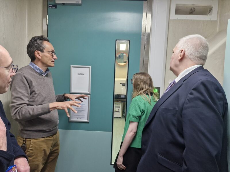Lab scientists talking to council staff
